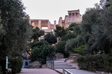 Sunrise view of the Acropolis of Athens, a historic fortress on a rocky hill above Athens, Greece. It features the ruins of several ancient structures, most notably the Parthenon.