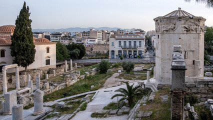 Obraz premium Sunrise view of the Roman Agora, located in the Old Town of Athens, north of the Acropolis and east of the Ancient Agora. These ruins date back to the Roman period.