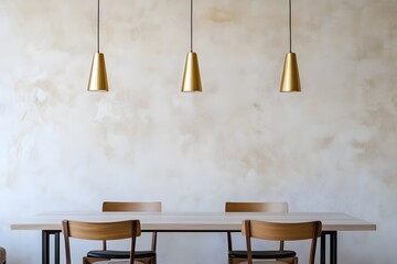 Minimalist interior design of modern dining room with brass pendant lights against beige stucco wall.