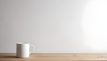 A white ceramic mug on a wooden table against a plain white wall