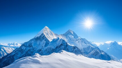 Obraz premium Majestic Snowy Mountain Peaks Under Bright Sun