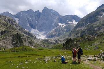 Beautiful scenery of Pyrenees National Park. Tourist trail to  Refuge des Oulettes de Gaube around mountain massif with glacier Oulettes and Vignemale - the highest peak of French Pyrenees. 