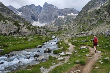 Fototapeta premium Beautiful scenery of Pyrenees National Park. Tourist trail to Refuge des Oulettes de Gaube around mountain massif with glacier Oulettes and Vignemale - the highest peak of French Pyrenees. 