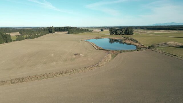 Small Pond On Farm In The Middle Of Agricultural Fields Canterbury New Zealand Drone Track In