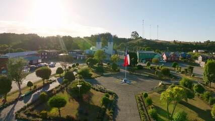 Aerial drone view of the square and the San Antonio de Chacao Church. Slow movement to the right - Powered by Adobe