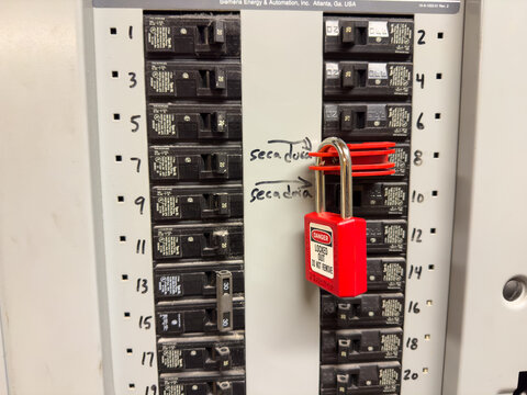 Pad lock on a breaker used for Lockout Tagout.