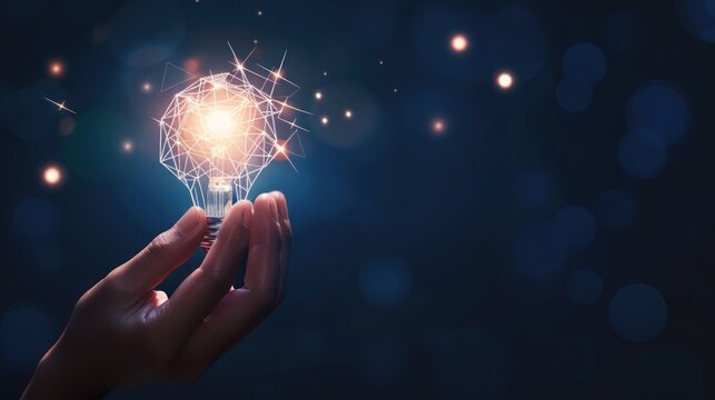 Hand Holding a Glowing Light Bulb with a Wireframe Design