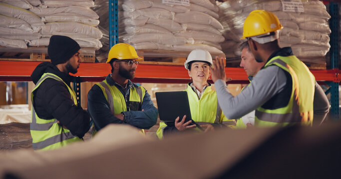 Logistics, team and laptop in warehouse for meeting, inventory management and compliance training. Woman operations manager, group and tech in storage for safety information, question and feedback