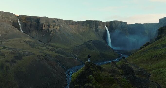 Man Watches Haifoss Waterfall In Iceland
