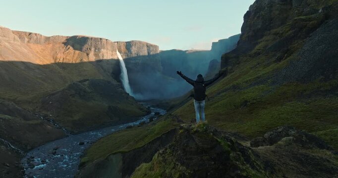 Man Admiring Haifoss Waterfall From Afar
