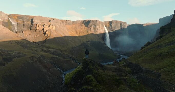 Adventurer Stands In Awe Of The Majestic Haifoss Waterfall