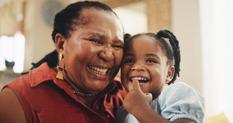 Smile, grandmother and child laughing at house for bonding, love and care together for family support. Happy, senior black woman and girl, embrace and funny joke, affection or retirement in lounge