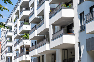 The facade of a white modern apartment building seen in Berlin, Germany