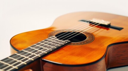 Fototapeta premium A beautifully crafted classical guitar with nylon strings and a rich wood grain, set against a pure white background to highlight its traditional design and artistry.