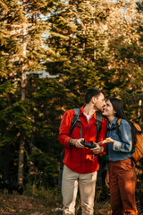 Bonding couple exploring the nature and using a drone to take a photos and videos