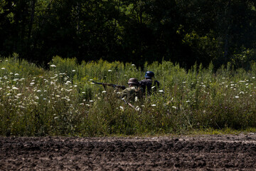 German infantry - soldiers of World War II on the battlefield. unrecognizable persons. Aquino Tank Weekend -  historical military show. Oshawa, Ontario, Canada