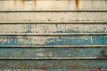 Old rusty metal sheet texture. Abstract wall grunge background. Oxidation on iron plate.