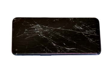 Close-up of a broken cell phone screen with visible cracks and shattered glass. Ideal for illustrating smartphone damage, repair topics, or technology issues. The background is softly blurred to empha