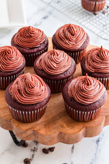 Red velvet cupcakes with swirled chocolate frosting