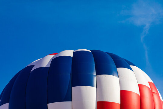Close-up of red, white, and blue hot air balloon