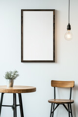A simple dark brown wooden frame hangs on the wall of a room with retro lighting and furniture.