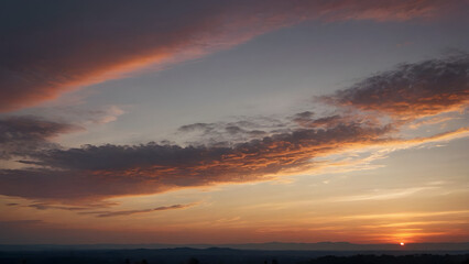 Obraz premium A sunset at the horizon with beautiful clouds