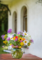 Fototapeta premium Beautiful Wild Summer Flowers in a Small Vase 