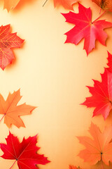 Fototapeta premium Product mockup scene of autumn leaves on golden background with empty space, flat lay 