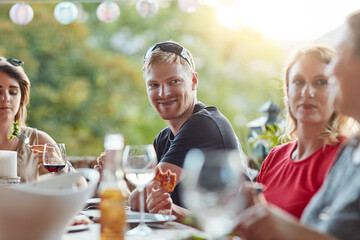 Friends, food and drinks at restaurant for celebration, birthday and brunch as event with conversation. Group of people, beer and pizza at outdoor pub for lunch, party or social reunion in New York