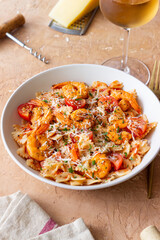 Farfalle pasta with shrimps, tomatoes and cheese. Healthy eating. Italian food.