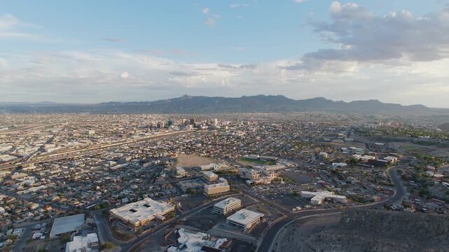 Drone shot of El Paso city landscape in Texas. Looking at the Cesar E. Chavez Border Highway (375) and Border wall in El Paso, TX before Title 42 Ends.