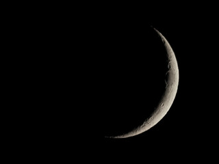 Waxing crescent moon seen with telescope