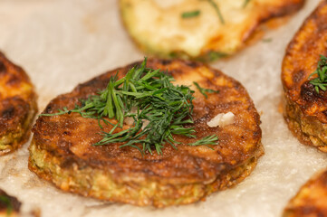 fried zucchini slices sprinkled with chopped parsley