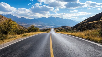 Fototapeta premium A long road with a mountain in the background