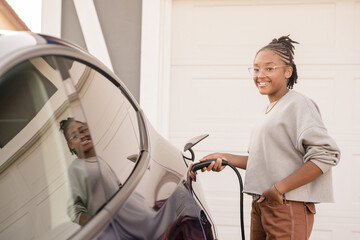 Young lady plugging in a charger at home