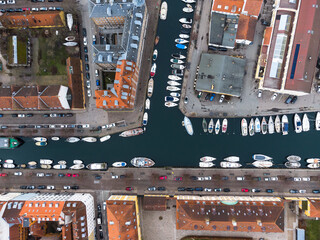 Copenhagen, Denmark: Aerial overhead view of the Christiana Neighbourhood with boats along a canal...