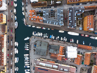 Copenhagen, Denmark: Aerial overhead view of the Christiana Neighbourhood with boats along a canal in Copenhagen, Denmark capital city