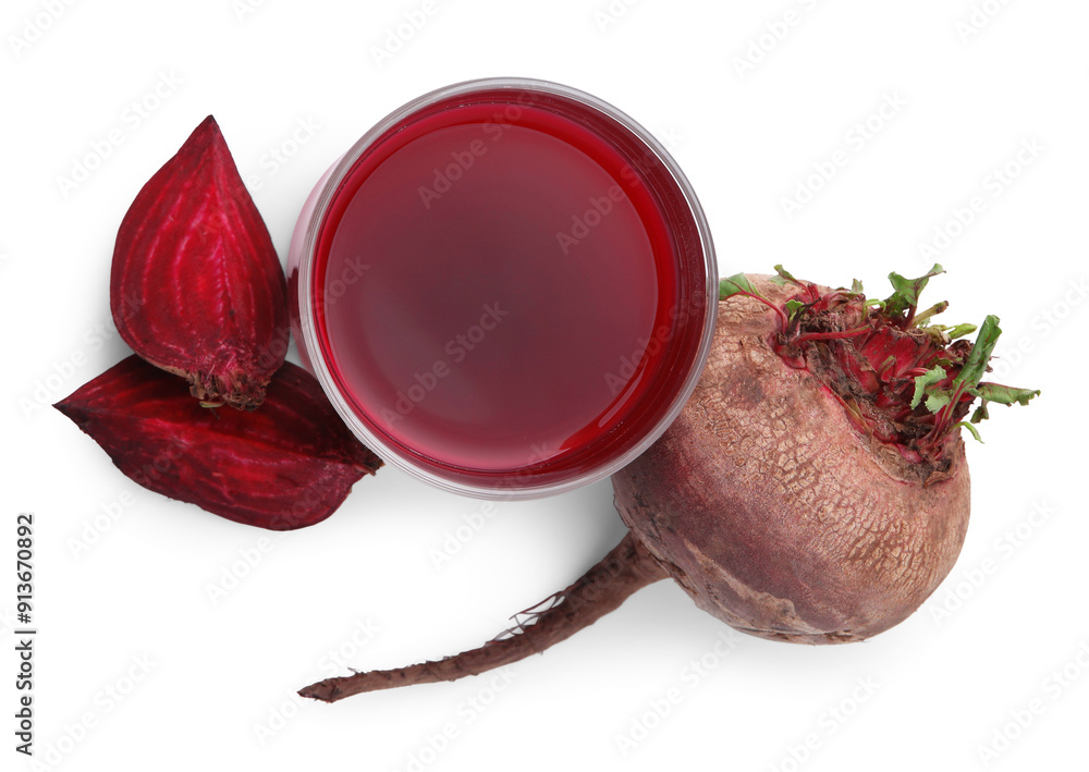 Wall mural Fresh beet juice in glass and ripe vegetables isolated on white, top view