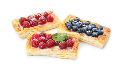 Tasty puff pastries with berries isolated on white