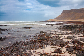 Iceland Landscape with ocean, mountains, coast, sky and clouds