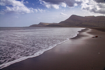 Iceland Landscape with ocean, mountains, coast, sky and clouds