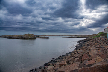 Iceland Landscape with ocean, mountains, coast, sky and clouds