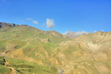 Fototapeta premium Road to the village of Khinaliq running through Greater Caucasus range located in the Quba District in Azerbaijan