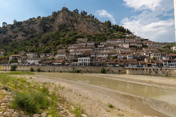 Sunset over the UNESCO town of Berat on the Osum River in Albania and known for its white Ottoman...