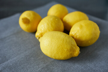 Lemons on a gray napkin, selective focus, close-up