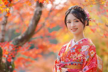 Fototapeta premium 赤い着物で紅葉を見ている女性