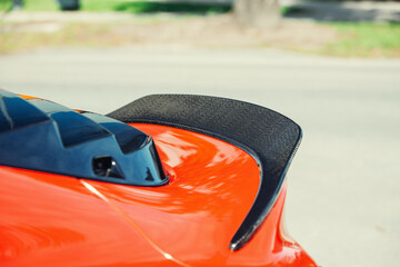 Modern supercar carbon spoiler wing at the trunk