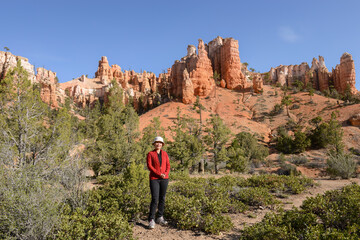 Fototapeta premium Woman posing for photos at Bryce Canyon National park. Utah. USA.