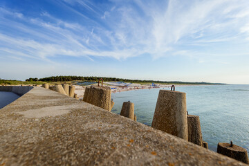 View of the western beach in Leba. Concrete breakwaters in the foreground. Beautiful sunny day....