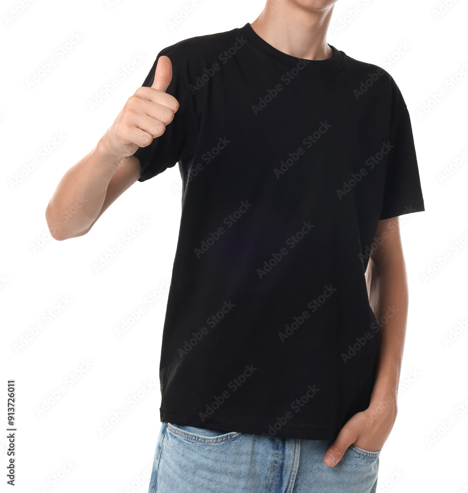 Canvas Prints Teenage boy wearing black t-shirt and showing thumbs up on white background, closeup